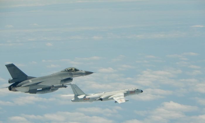 A Taiwanese Air Force F-16 fighter jet flies alongside a Chinese People's Liberation Army Air Force (PLAAF) H-6K bomber in the western Pacific, one of the Chinese military aircraft that reportedly flew over Bashi Channel and Miyako Strait near Japan’s Okinawa island chain on the morning of May 11, 2018. (Released by Taiwan ROC Air Force)