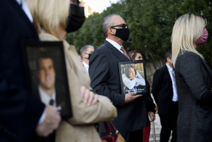 Jaime Puerta holds a portrait of his son Daniel Puerta-Johnson, who died in April 2020 at the age of 16 from a pill containing fentanyl, during a news conference outside the Roybal Federal Building in Los Angeles on February 24, 2021. Photo: Patrick T. Fallon/AFP via Getty Images