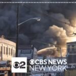 Warehouse fire in Elizabeth, New Jersey still burning after more than 12 hours, but contained, officials say