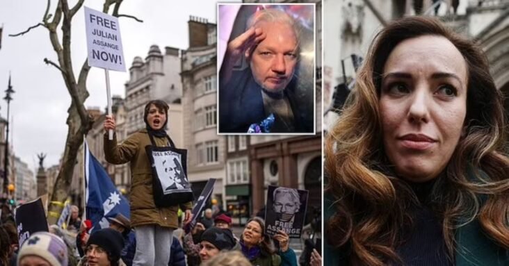 Julian Assange's extradition to the US for 'espionage' is illegal because he is accused of 'political offences', court told - as WikiLeaks founder's wife joins protesters demanding his release
