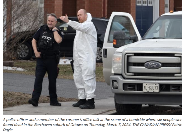 A police officer and a member of the coroner's office talk at the scene of a homicide where six people were found dead in the Barrhaven suburb of Ottawa on Thursday,