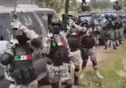 WATCH: Armed masked gunmen in front of armored vehicles chant name of wanted Jalisco Cartel boss